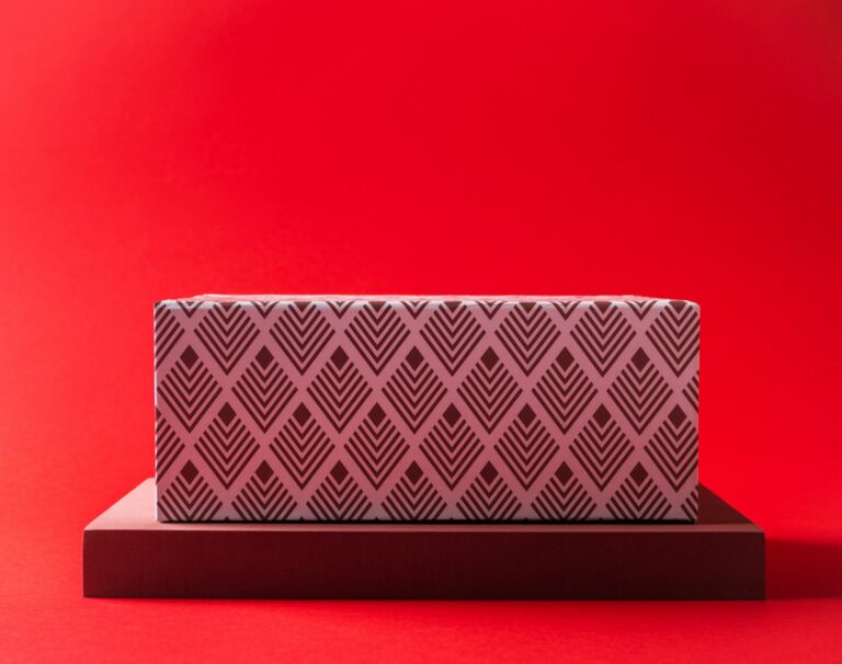 Geometric design box podium on red background. Mockup empty scene